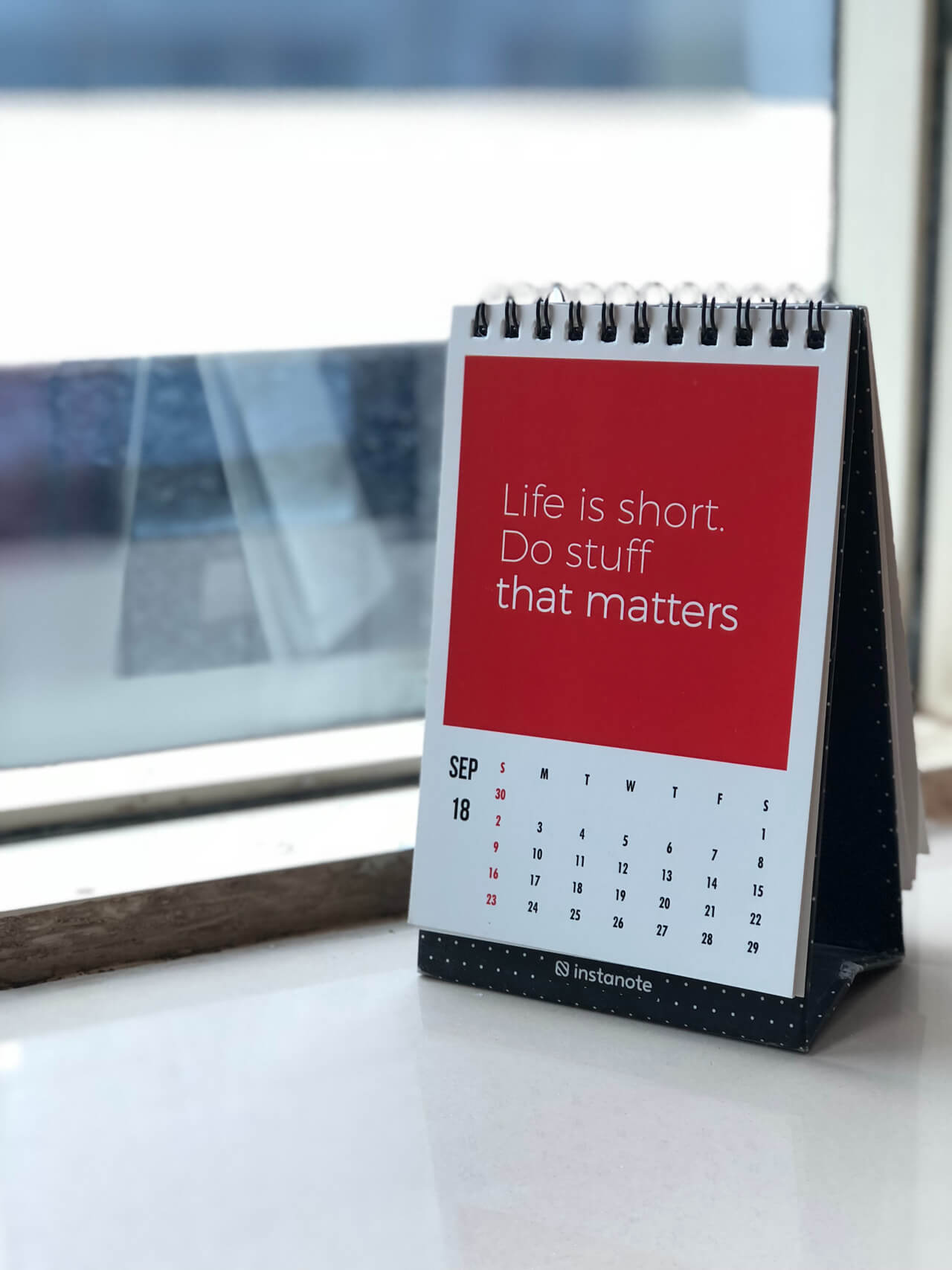 A red desk calendar that says "Life is short, Do stuff that matters"