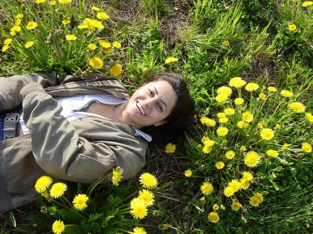 Randa El Zein lying in a field 