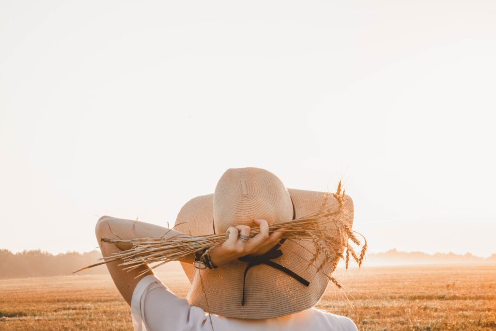 A woman standing alone in a field 