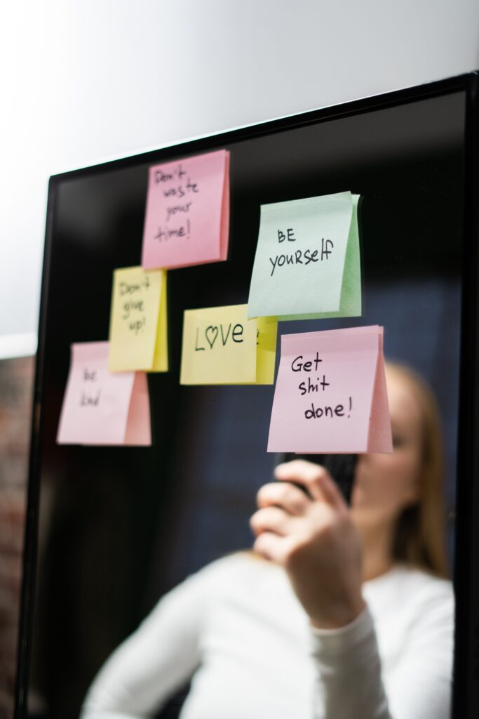 Post it notes on a mirror with inspirational messages