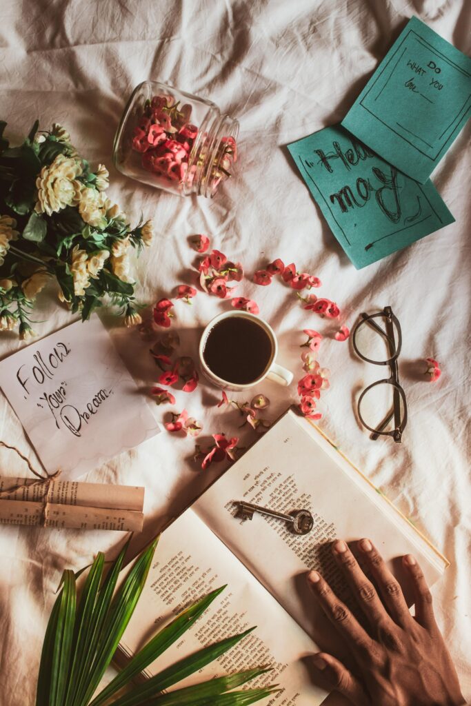 A book sitting on a table net to inspirational post it notes 