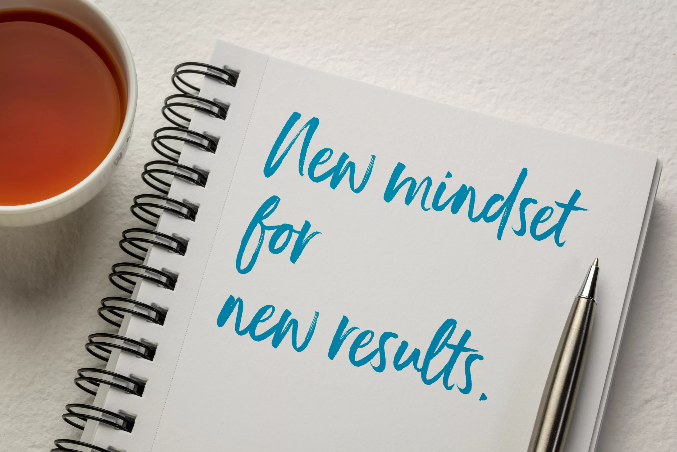 A notebook that reads: New Mindset for new results