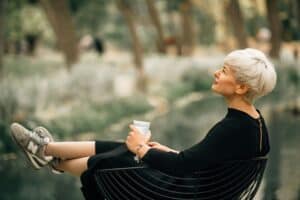 mature woman reflecting calmly, considering psychology-based coaching