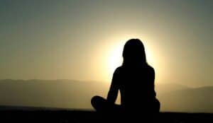 woman in midlife meditating